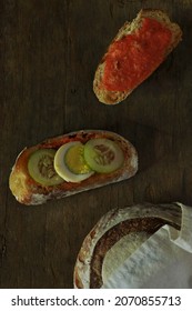 Sliced Sourdough Bread With Tomato Paste, Egg And Cucumber On Top