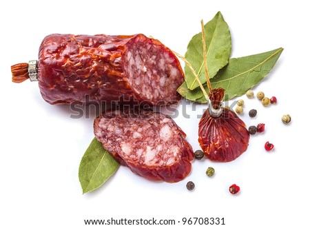 Sliced ??sausage with spices isolated on white background
