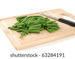 Sliced string beans on a chopping block