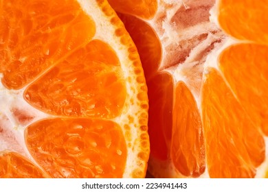 sliced sweet ripe tangerine close-up , macro photo , delicious and healthy citrus fruit , vitamin concept - Shutterstock ID 2234941443