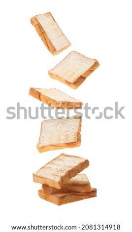 Sliced toasts bread falling isolated on white background