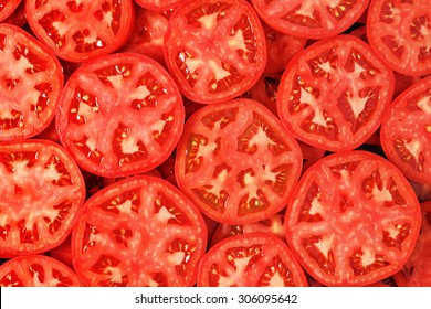Sliced tomatoes background. 