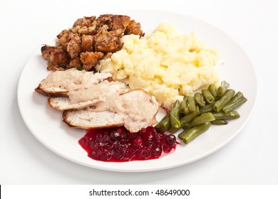 Sliced Turkey Breast With Garnish On A Plate