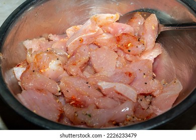 Sliced Turkey Meat With Spices In An Iron Bowl