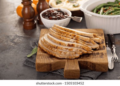 Sliced Turkey On A Cutting Board For Thanksgiving Or Christmas Dinner Table