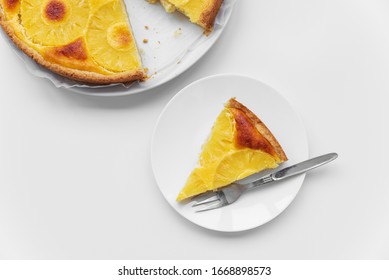 Sliced Upside Down Pineapple Cake With Cup Of Tea On White Table. Summer Tropical Dessert. Top View. Copy Space