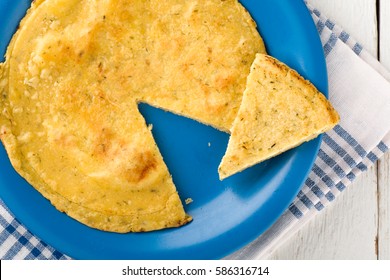 Sliced Vegan Chickpea Omelette On Blue Dish