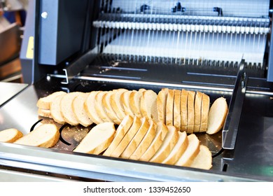 Sliced White Bread In A Cutting Machine