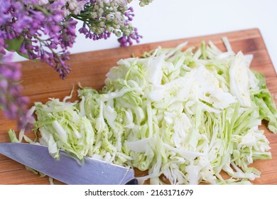 Sliced White Cabbage. Slicing Vegetables On A Wooden Board