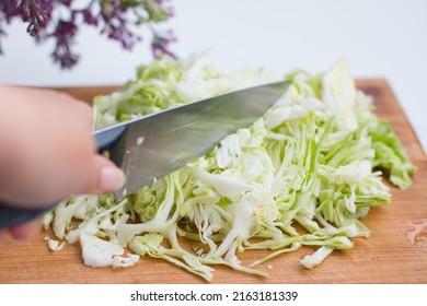 Sliced White Cabbage. Slicing Vegetables On A Wooden Board