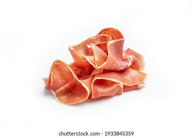 Slices of appetizing jamon. Raw ham. Isolated on white background. - Shutterstock ID 1933845359