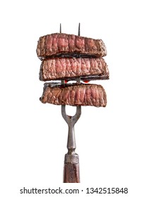 Slices Of Beef Steak On Vintage Fork Isolated On White