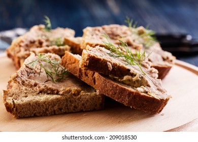 Slices Of Bread With Baked Pate On Wooden Board