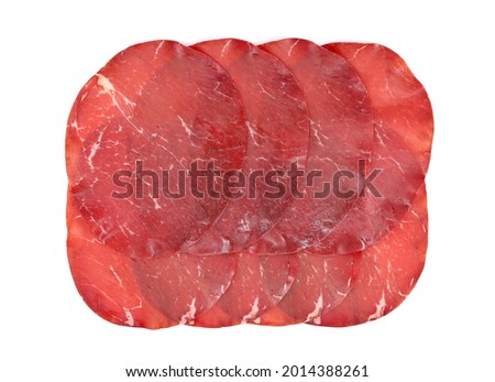 Slices of Bresaola, traditional  air dried salted beef cold meat from North Italy, on white background. 