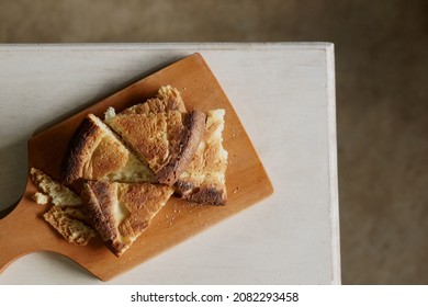 Slices Of Burnt Bread On A Wooden Placemat