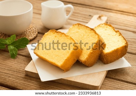 Slices of butter cakes with small white jar and coffee cup. Stock photo © 