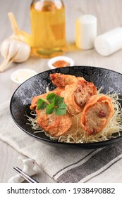 Slices Of Chicken Egg Rolls, Is Omelete Egg Stuffed With Ground Chicken And Spices, Steamed And Deep Fry, Served With Chili Mayonaise Sauce Above Crispy Vermicelli