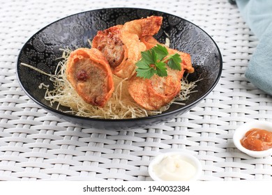 Slices Of Chicken Egg Rolls, Is Omelete Egg Stuffed With Ground Chicken And Spices, Steamed And Deep Fry, Served With Chili Mayonaise Sauce Above Crispy Vermicelli