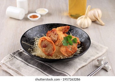 Slices Of Chicken Egg Rolls, Is Omelete Egg Stuffed With Ground Chicken And Spices, Steamed And Deep Fry, Served With Chili Mayonaise Sauce Above Crispy Vermicelli