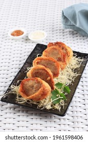 Slices Of Chicken Egg Rolls, Is Omelete Egg Stuffed With Ground Chicken And Spices, Steamed And Deep Fry, Served With Chili Mayonaise Sauce Above Crispy Vermicelli