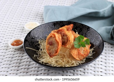 Slices Of Chicken Egg Rolls, Is Omelete Egg Stuffed With Ground Chicken And Spices, Steamed And Deep Fry, Served With Chili Mayonaise Sauce Above Crispy Vermicelli