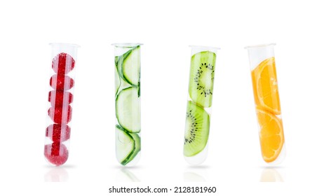 Slices Of Cucumber, Kiwi, Orange And Raspberries In Test Tubes Isolated On White. Natural Cosmetics, Natural, Alternative Medicine Concept