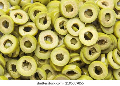 Slices Of Cut Green Olives As Background, Closeup