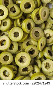 Slices Of Cut Green Olives As Background, Closeup