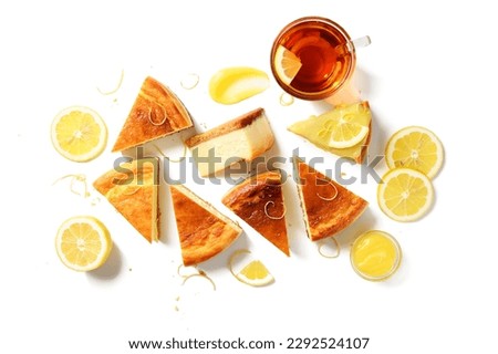 Slices of fresh baked homemade lemon cheesecake with lemon curd and lemon slices. isolated on white background, top view