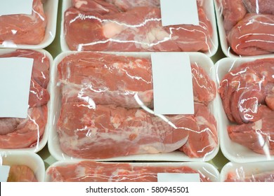 Slices of fresh beef on plastic packages in fridge - Powered by Shutterstock