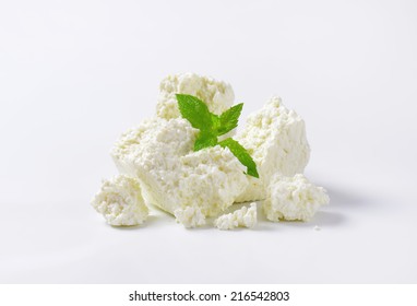 Slices Of Fresh Cheese On White Background