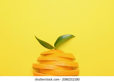 Slices of fresh oranges with green leaves on color background - Shutterstock ID 2080252180