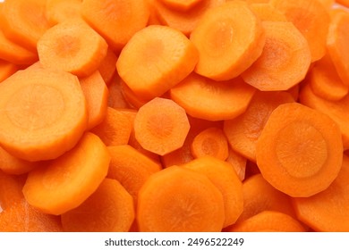 Slices of fresh ripe carrot as background, top view - Powered by Shutterstock