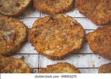 Slices Of Fried Breaded Eggplant On A Tray.