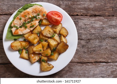 Slices Of Grilled Chicken Steak With Potatoes And Vegetables. Top View