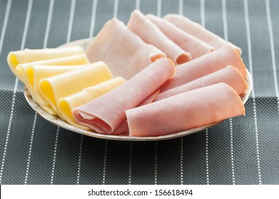 Slices Of Ham And Cheese On Plate