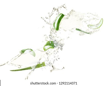 Slices of juicy aloe with fresh water splashes on white background