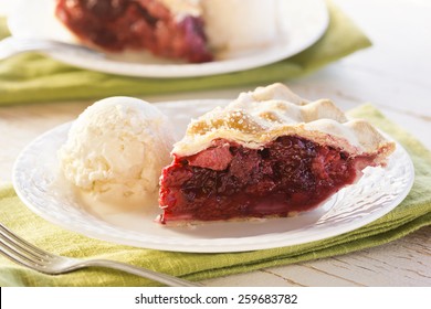 Slices Of Mixed Berry Pie With Ice Cream