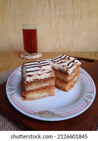 A Slices Of Mocha Cake In A Plate