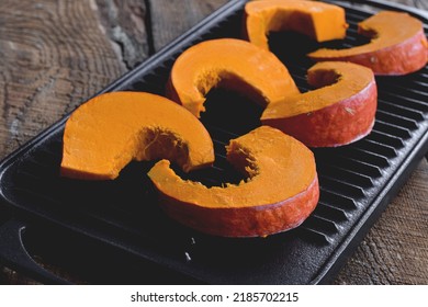 Slices Of Orange Buttercup Winter Squash On Grill