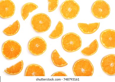 Slices of orange or tangerine isolated on white background. Flat lay, top view. Fruit composition