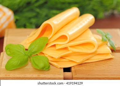 Slices Of Processed Cheese With Greens