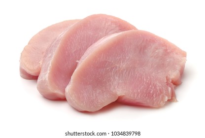Slices of raw turkey meat fillet isolated on white