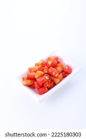 Slices Of Red Cayenne Pepper On A White Background