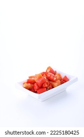 Slices Of Red Cayenne Pepper On A White Background