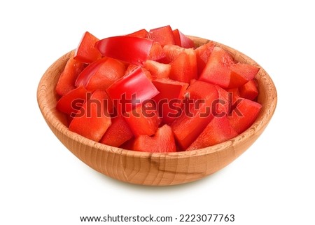 slices of red sweet bell pepper in wooden bowl isolated on white background with full depth of field