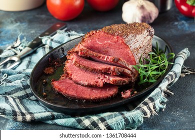 Slices of roast beef on cutting board