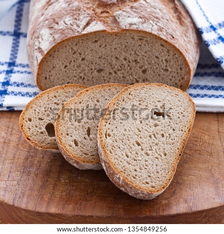 Similar – Image, Stock Photo Rustic bread on wooden table