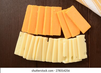 Slices Of Sharp Cheddar And Swiss Cheeses