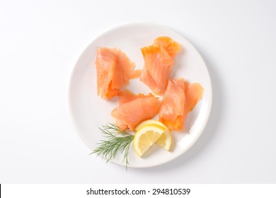 Slices Of Smoked Salmon On White Plate